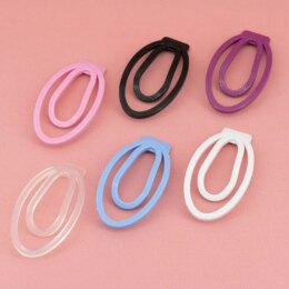 Colorful hairbands on pink background