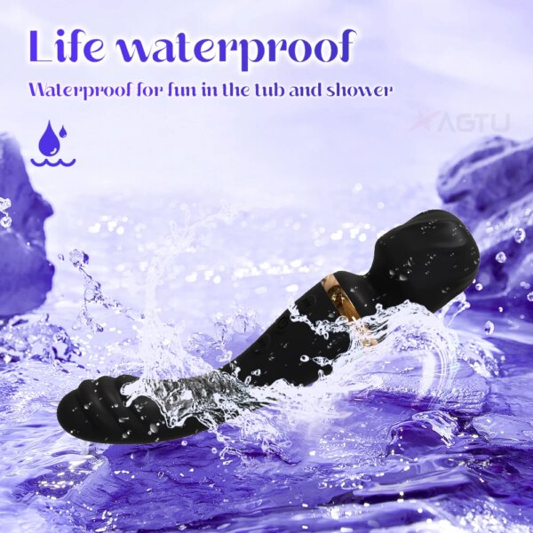 Waterproof black vibrator splashing in water.