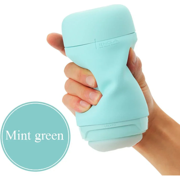 Hand holding a mint green object