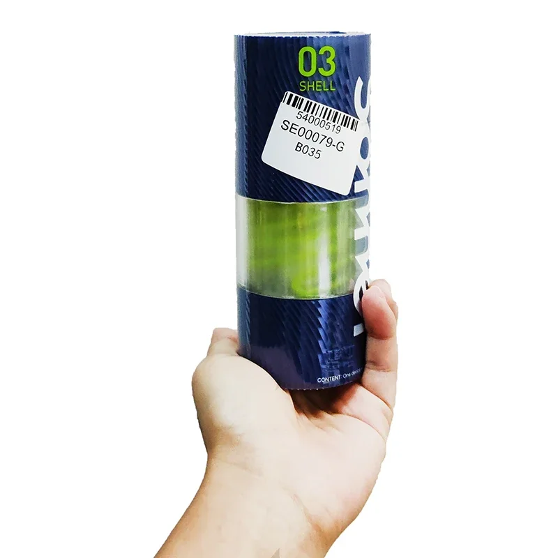 Hand holding blue cylindrical product container