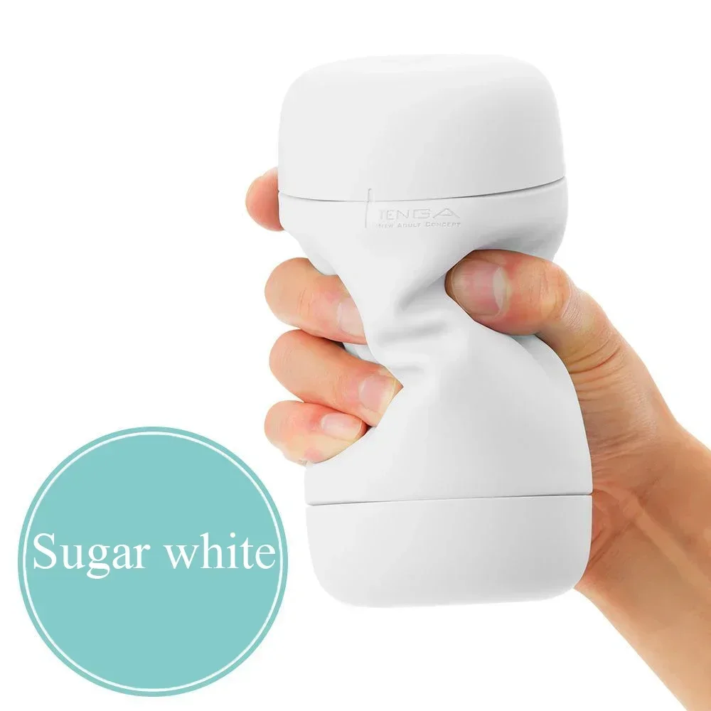Hand holding white Tenga adult toy